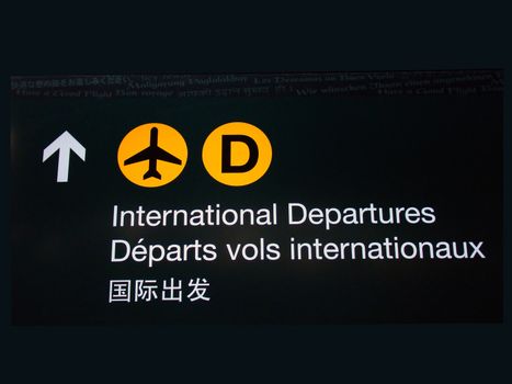 International departures sign at Canadian airport.