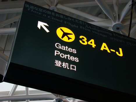 Departure gate sign at international airport.