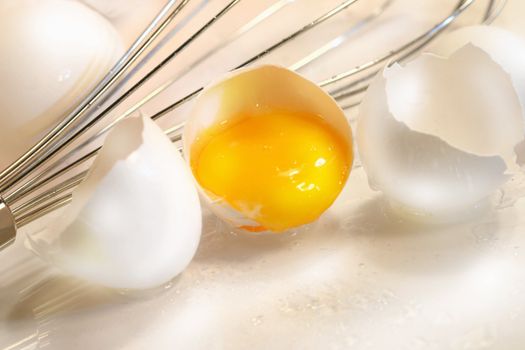 Cracked egg with yolk and egg shell