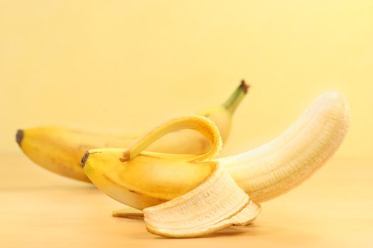 Bananas with banana peel on counter