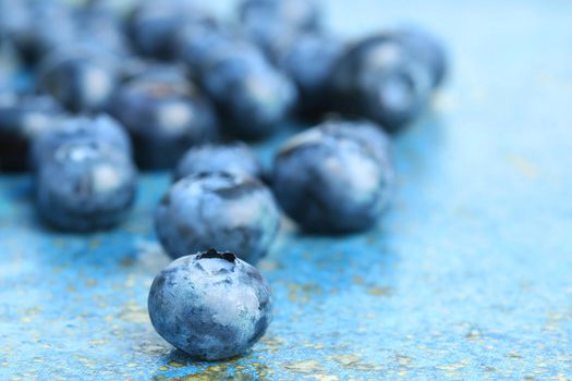 Blueberries on  blue background