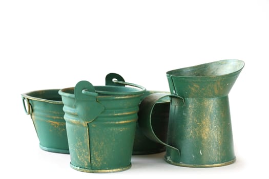 Rustic tin objects isolated on a white background.