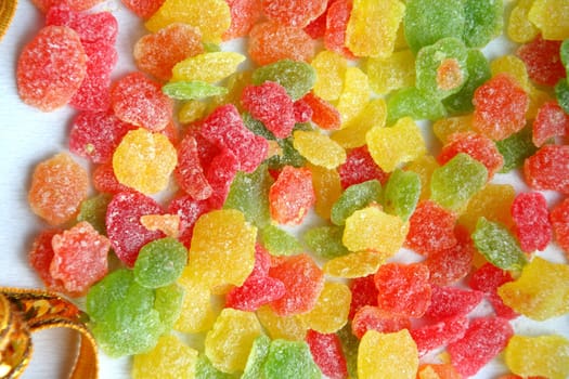 Heap of small sweets which were scattered on a table