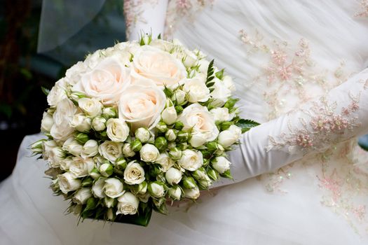 bride, wedding dress and flower bouquet