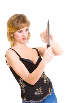 sharp knife in the hands of a pretty girl