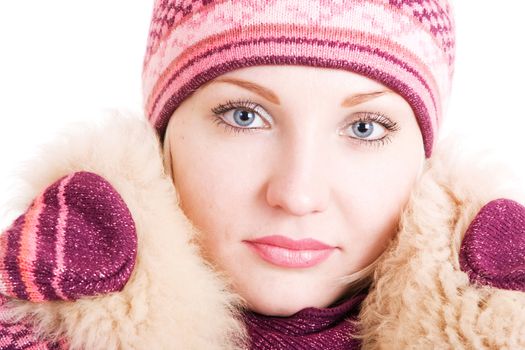 a serious beautiful young woman with a fur collar put up