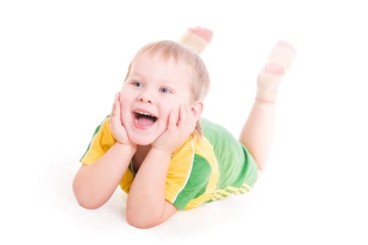 a smiling happy boy with the open mouth on the floor