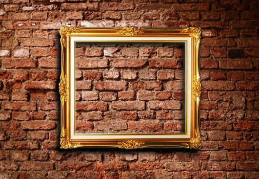 Golden frame against grunge brick wall texture