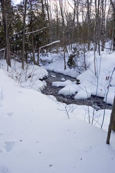 Snowy creek with snow bumps