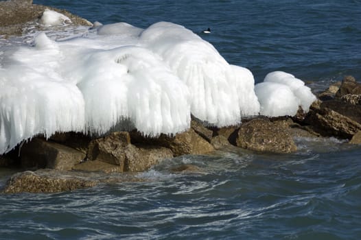Ice island in Ontario lake in winter evening.