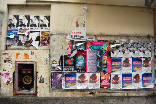 Wall posters at Auckland side street, New Zealand