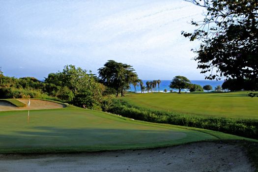 Jamaican ocean side golf course with view towards the green