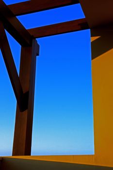 Sunset shadow and warm beams with orange glow on  a tropical balcony