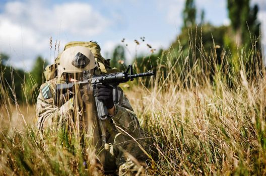 U.S. Soldier in full gear guards his position in Iraq