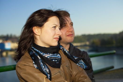 young couple on the Charles Bridge on the skyline