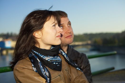 young couple on the Charles Bridge on the skyline