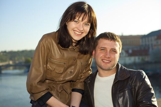 young couple on the Charles Bridge on the skyline