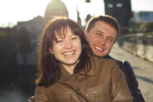 young couple on the Charles Bridge on the skyline