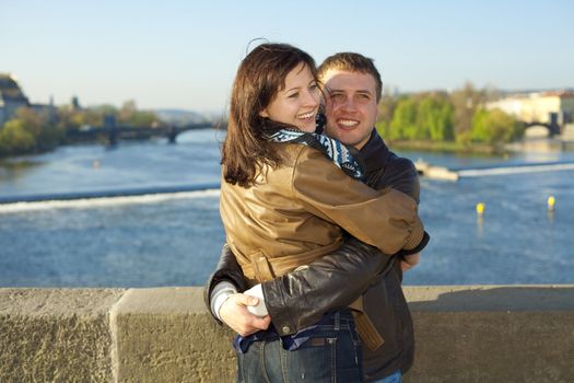 young couple on the Charles Bridge on the skyline