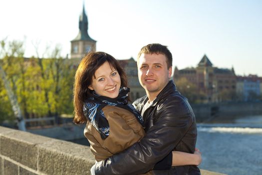 young couple on the Charles Bridge on the skyline