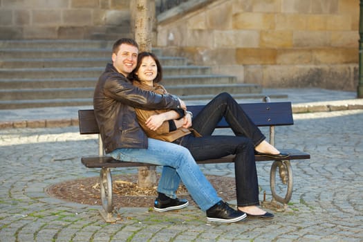 love couple sitting on the bench