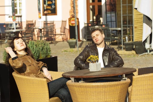 love couple sitting at a table in a cafe