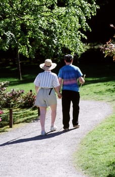 Blind couple walking in the park together on a blind date.