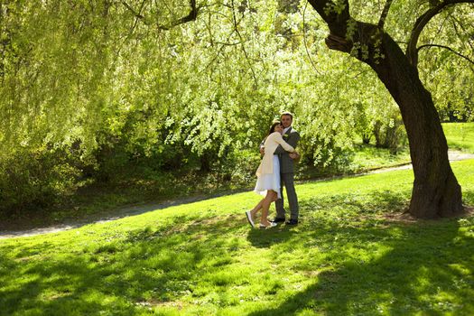 just married standing under the greenwood tree