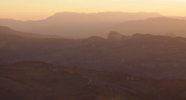 The rolling hills of San Marino at dusk shot from Monte Titano. ( the city of San Marino )
