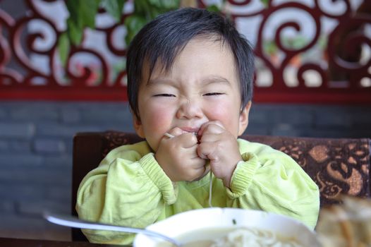 a cute baby is eating