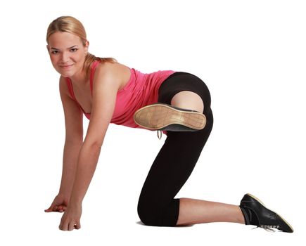 Youngblonde woman doing aerobics,against a white background