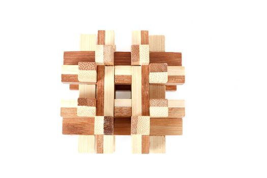 solved wooden puzzle isolated on white background