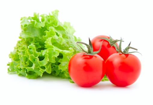Red cherry tomato  and fresh lettuce, isolated on white background 