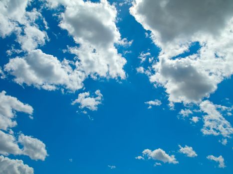 blue sky is covered by white clouds 