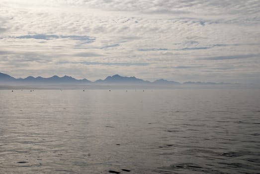 Clouds reflected in the still waters of Mossel Bay