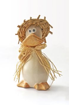 toy of the ugly duckling in  straw hat and in scarf