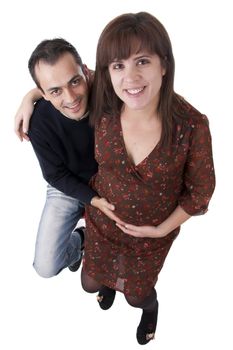 husband holding belly of pregnant woman