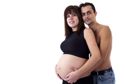 husband holding belly of pregnant woman
