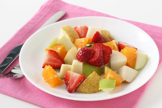 fruit salad on the white plate
