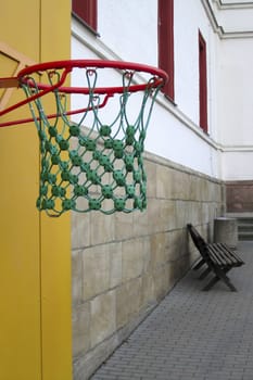 Basketball against a background of an empty school yard