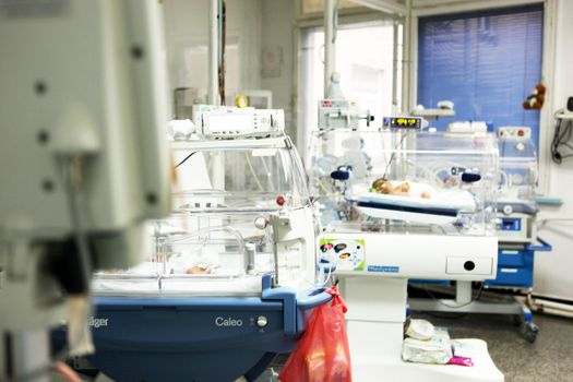 Newborn baby inside incubator