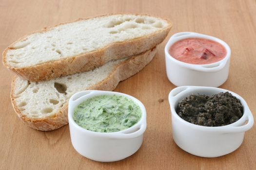 bread with dip in small bowls