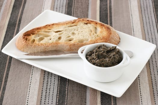 bread with olive paste in the bowl