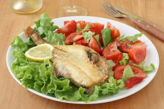 fried fish with salad
