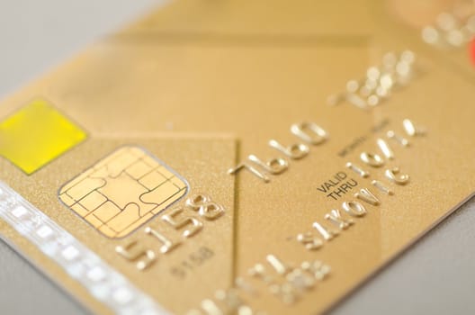 Gold bank card, macro, narrow focus