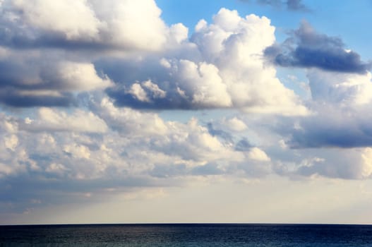 Scenery with calm sea and fluffy sky