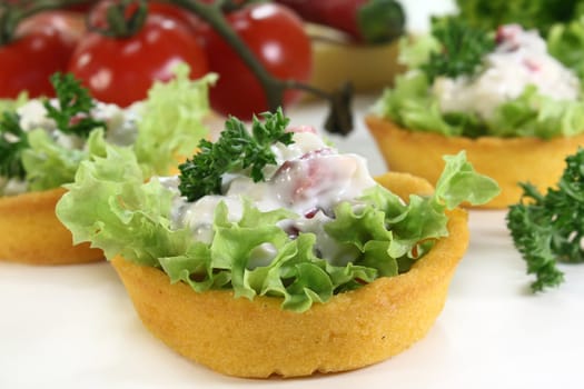 Corn cakes with cheese salad on a white background