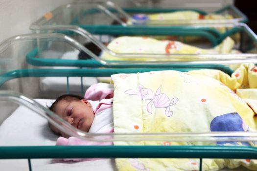 Newborn baby inside incubator
