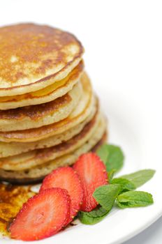 Pancake Fritters with strawberry and leaflets of mint