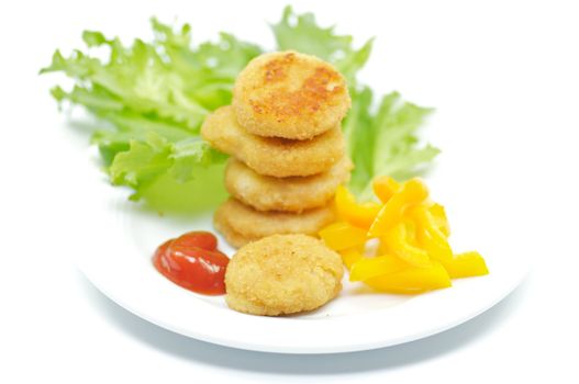 Chicken Nuggets with salad leaves and bell pepper